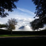 Curvy wave on the outside; milky light cascading on the inside – with a sombre south american art installation